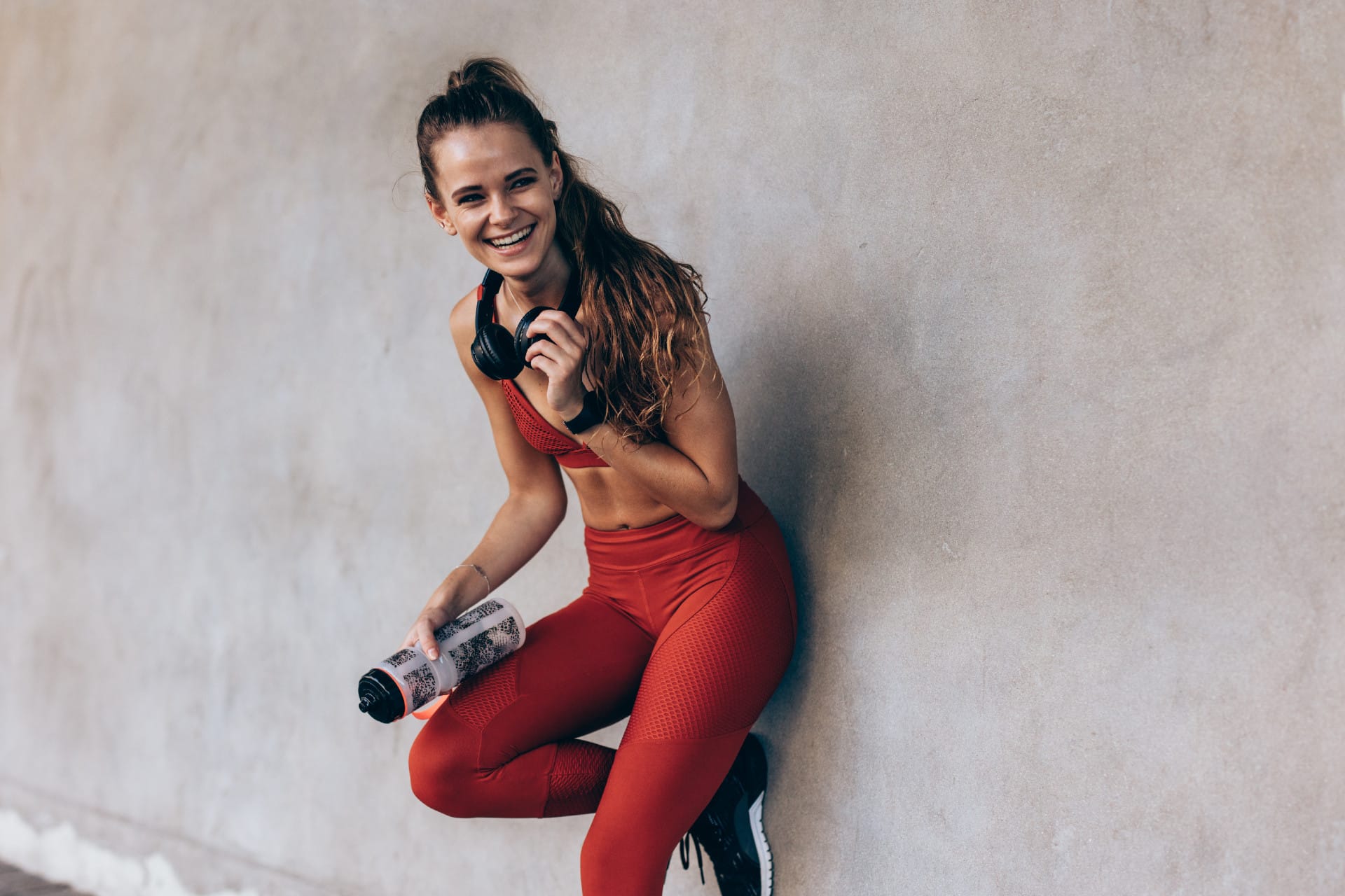 woman exercising standing smiling